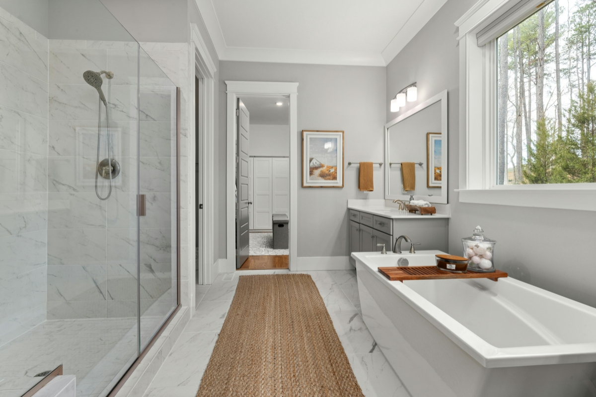 Tub to shower conversion Concord NC — before and after stone shower installation