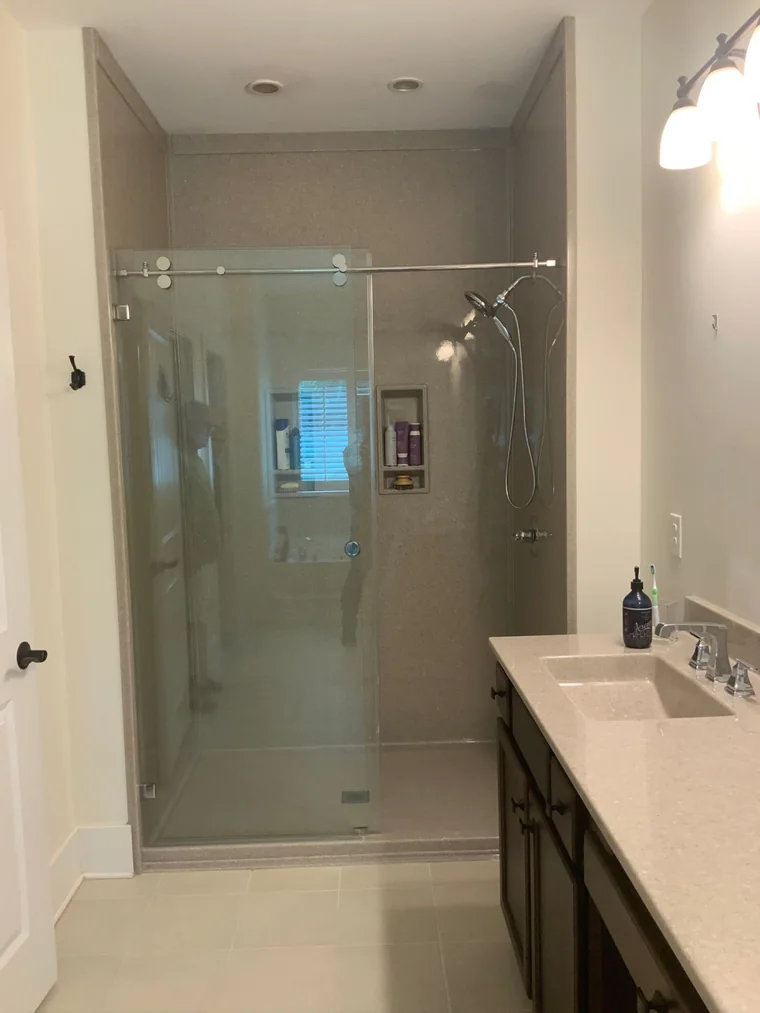 Frameless glass shower with full-height surround after the upgrade